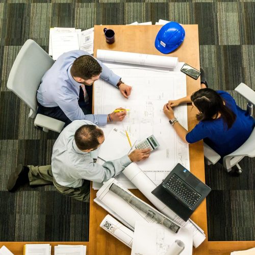 A professional team coordinating plans for BPO property preservation and REO vendor management.