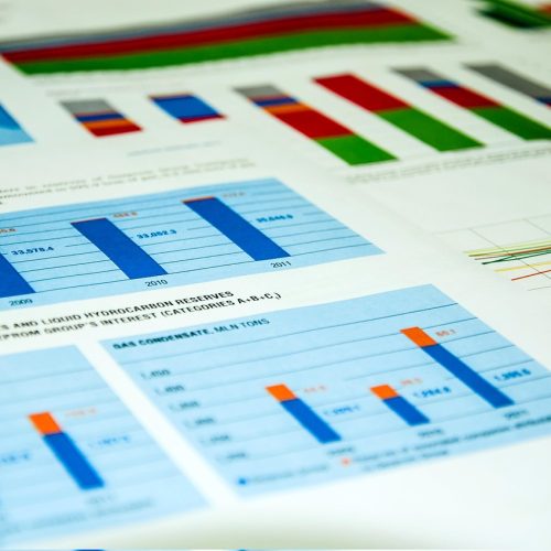 Financial charts and reports illustrating record to report outsourcing services